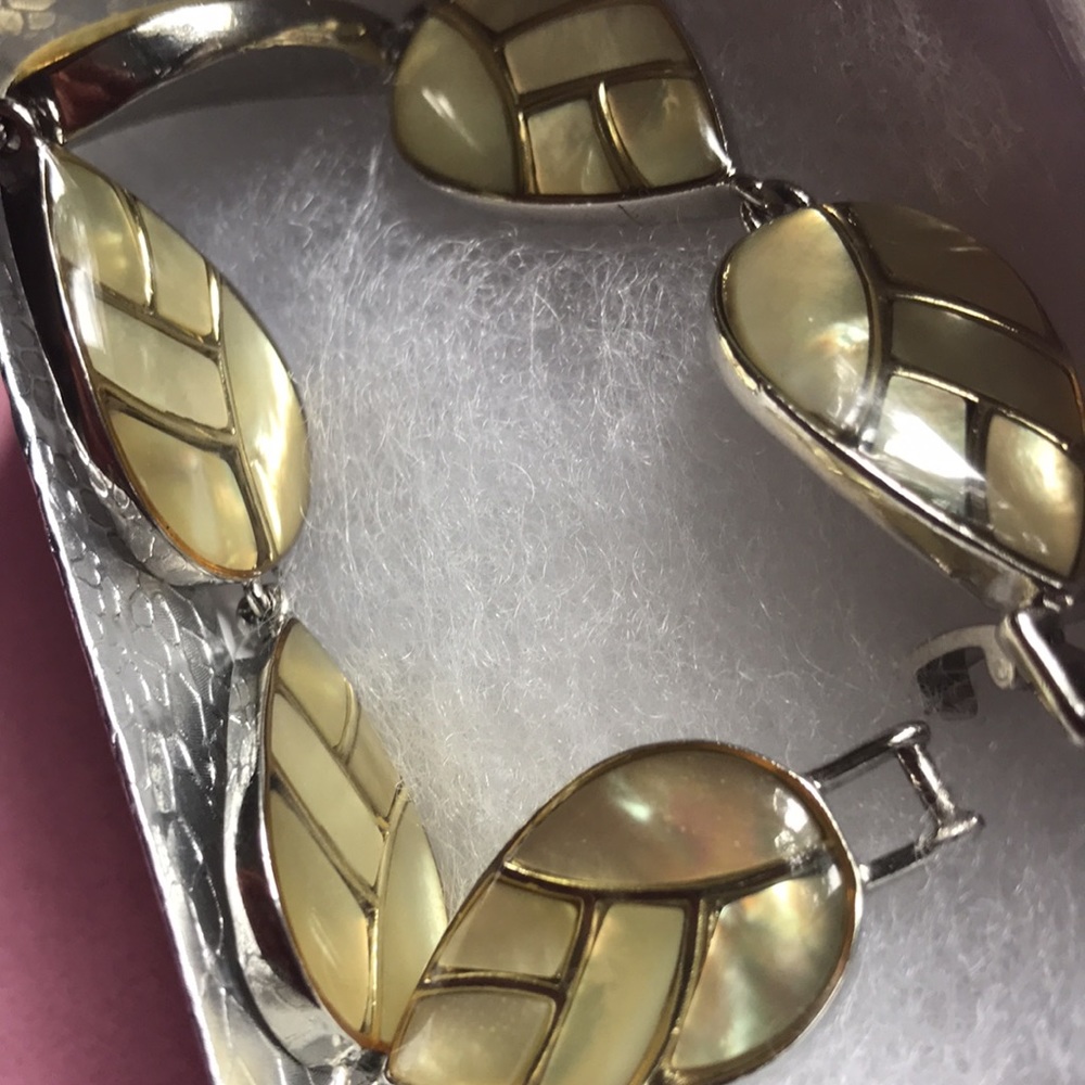 Lia Sophia Enamel over abalone silvertone bracelet. Leaf/tear drop shape.